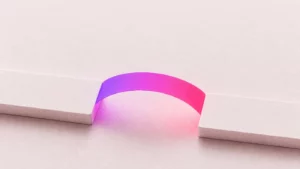 Two paper slabs with a glowing gradient arc bridging the gap between them